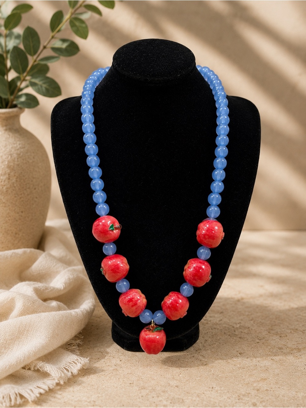 Handcrafted Blue Beaded Necklace with Red Apple Accents